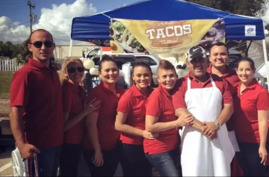 Team of taco vendors at a food festival