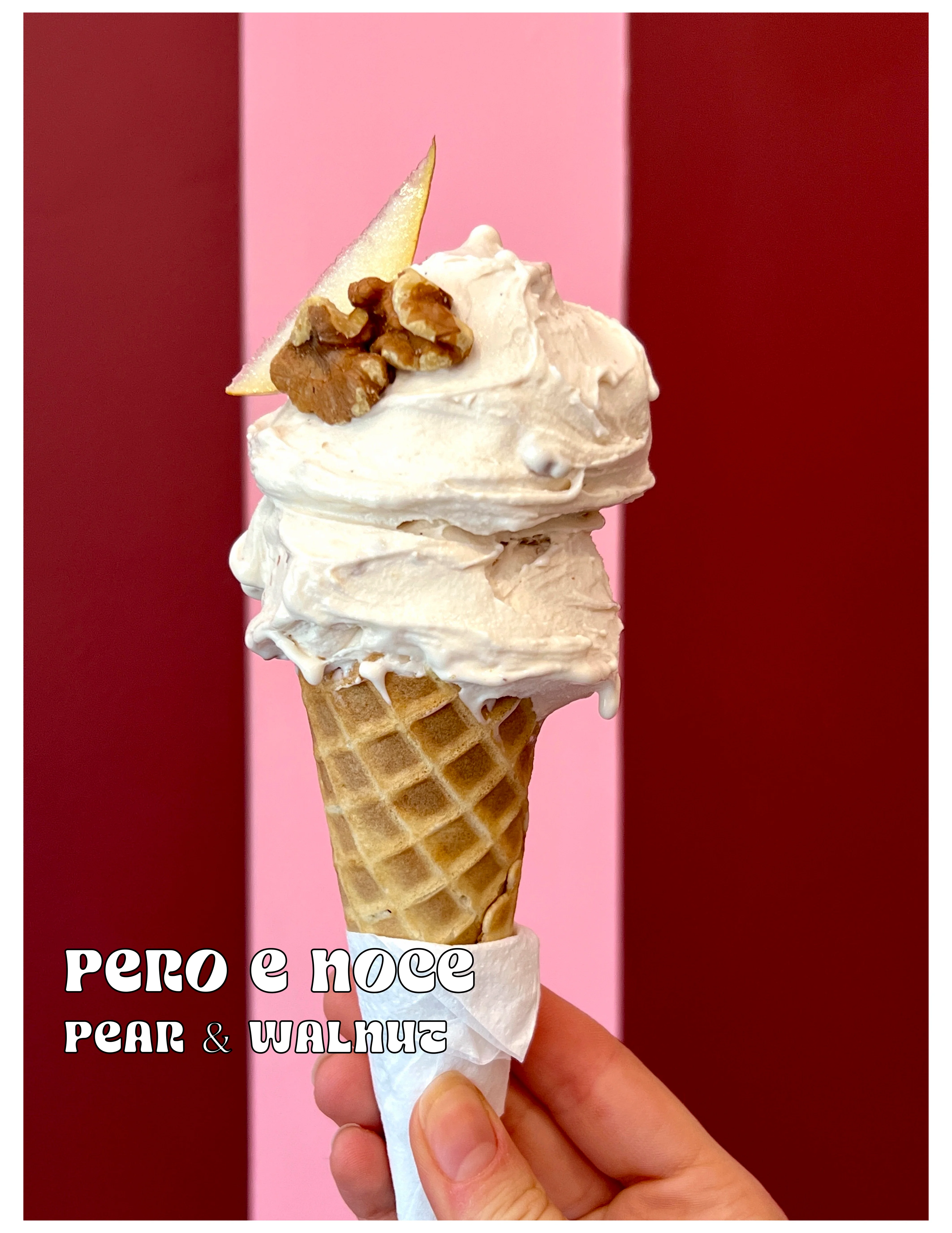 Marasca cherry stracciatella ice cream cone with tropical backdrop