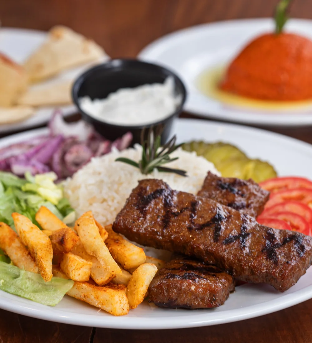 Grilled kebab platter with rice and vegetables