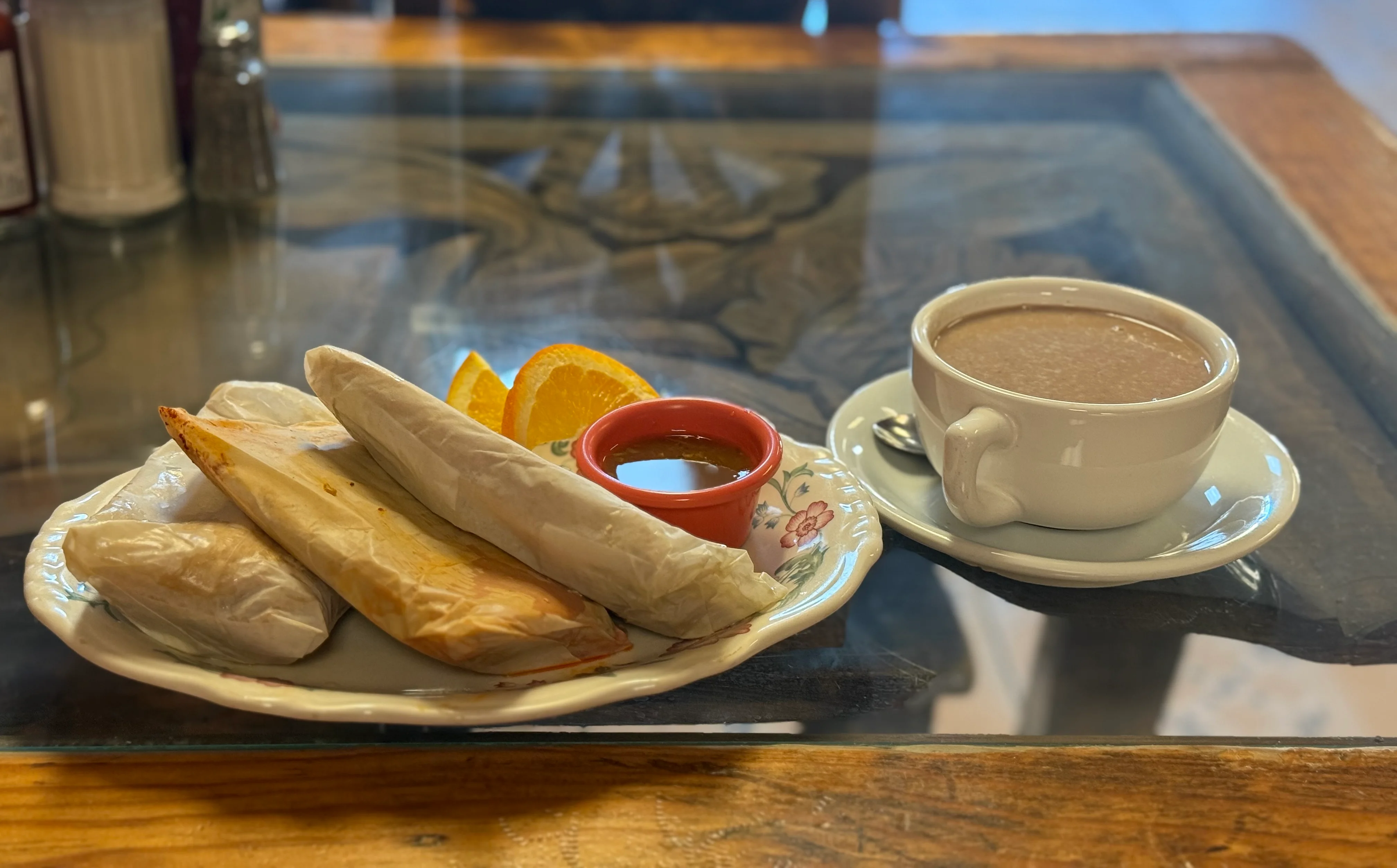 Traditional Mexican breakfast with tamales and hot chocolate