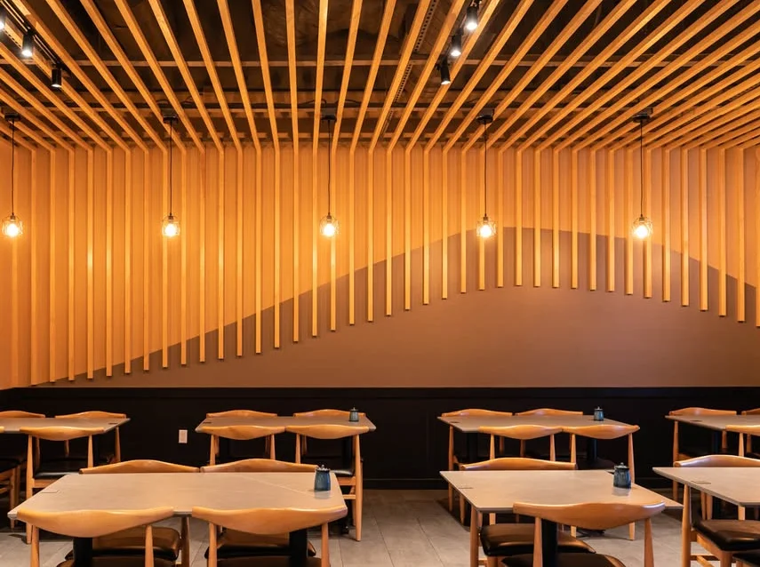 Modern restaurant interior with wooden accents and warm lighting