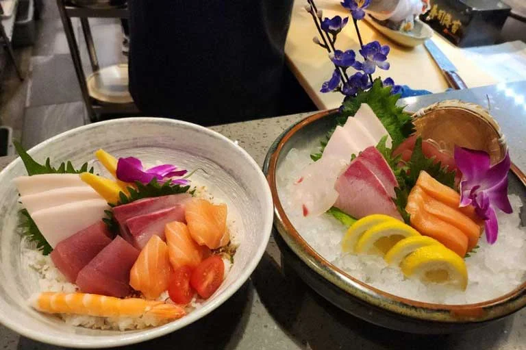 Sashimi dishes with flowers