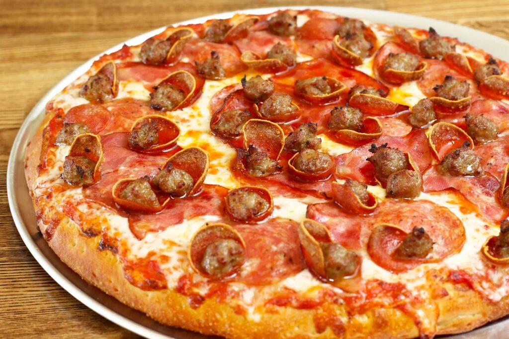 Loaded meat lover's pizza with pepperoni and sausage