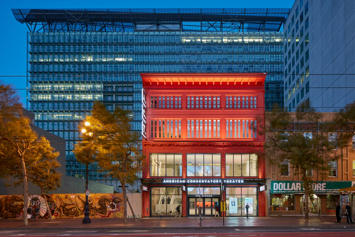 A.C.T.'s Strand Theater. A red four story building on Market Street in San Francisco. 