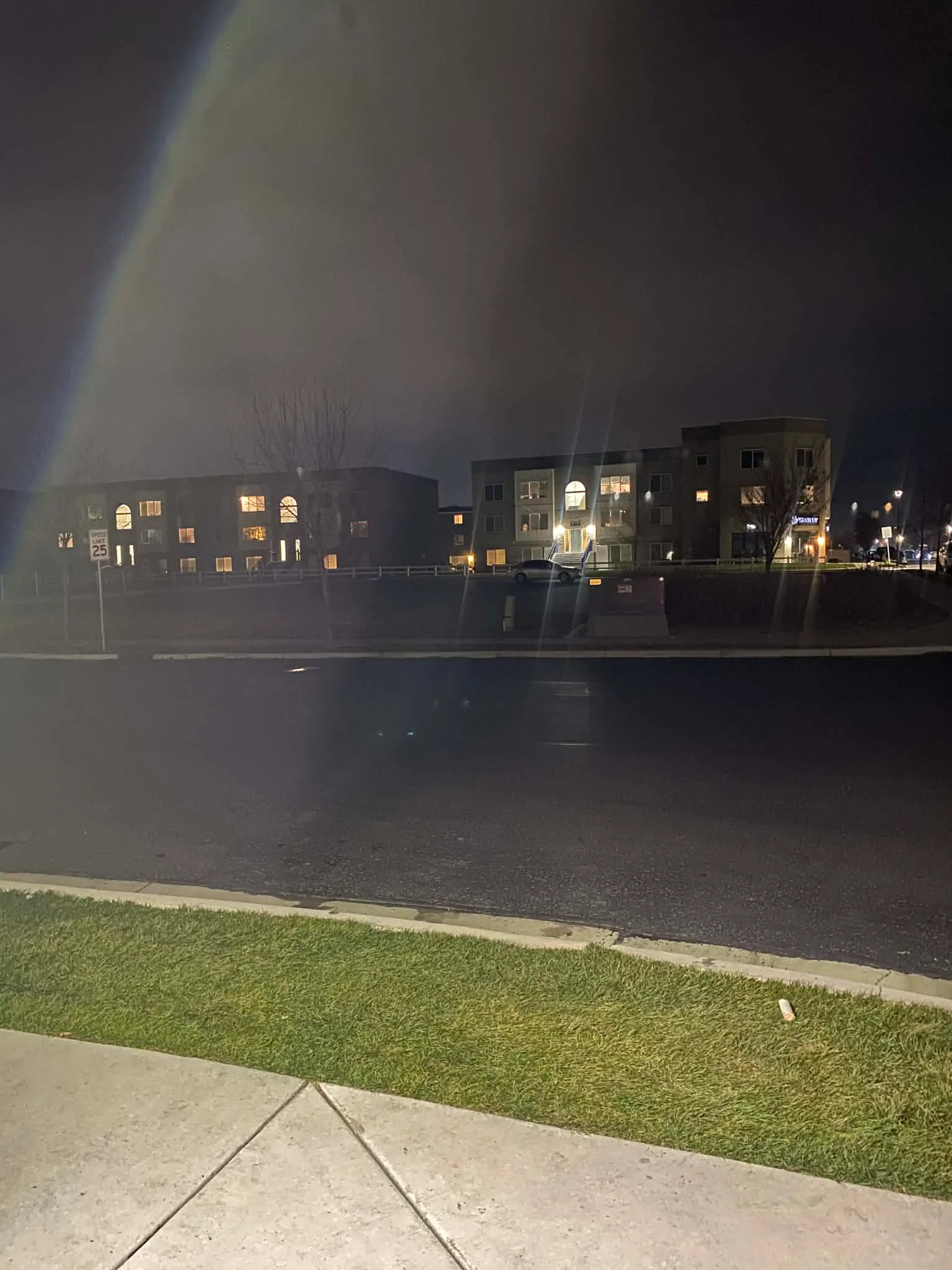 Night view of modern apartment buildings with illuminated windows