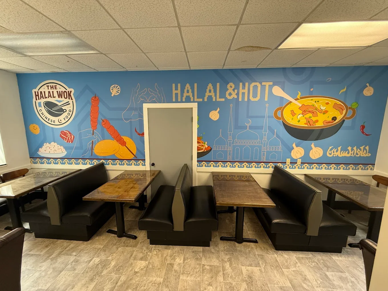 Cozy restaurant interior with vibrant halal-themed mural