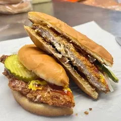 Delicious gourmet burger with fresh toppings on a wooden table