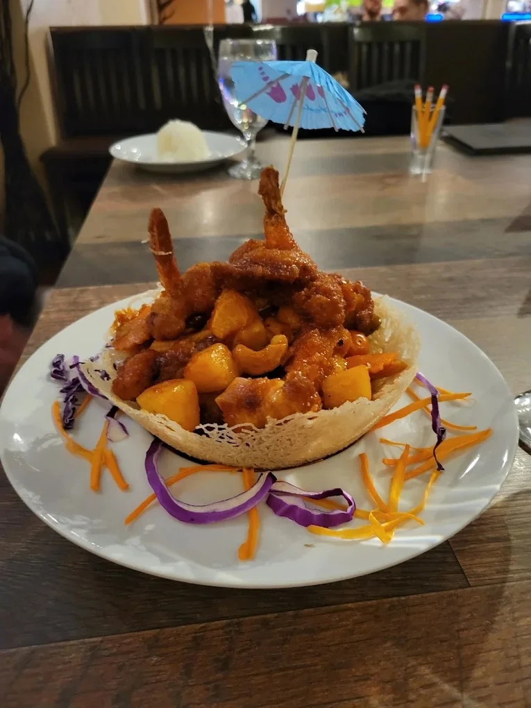 Crispy sweet and sour shrimp served in a fried basket