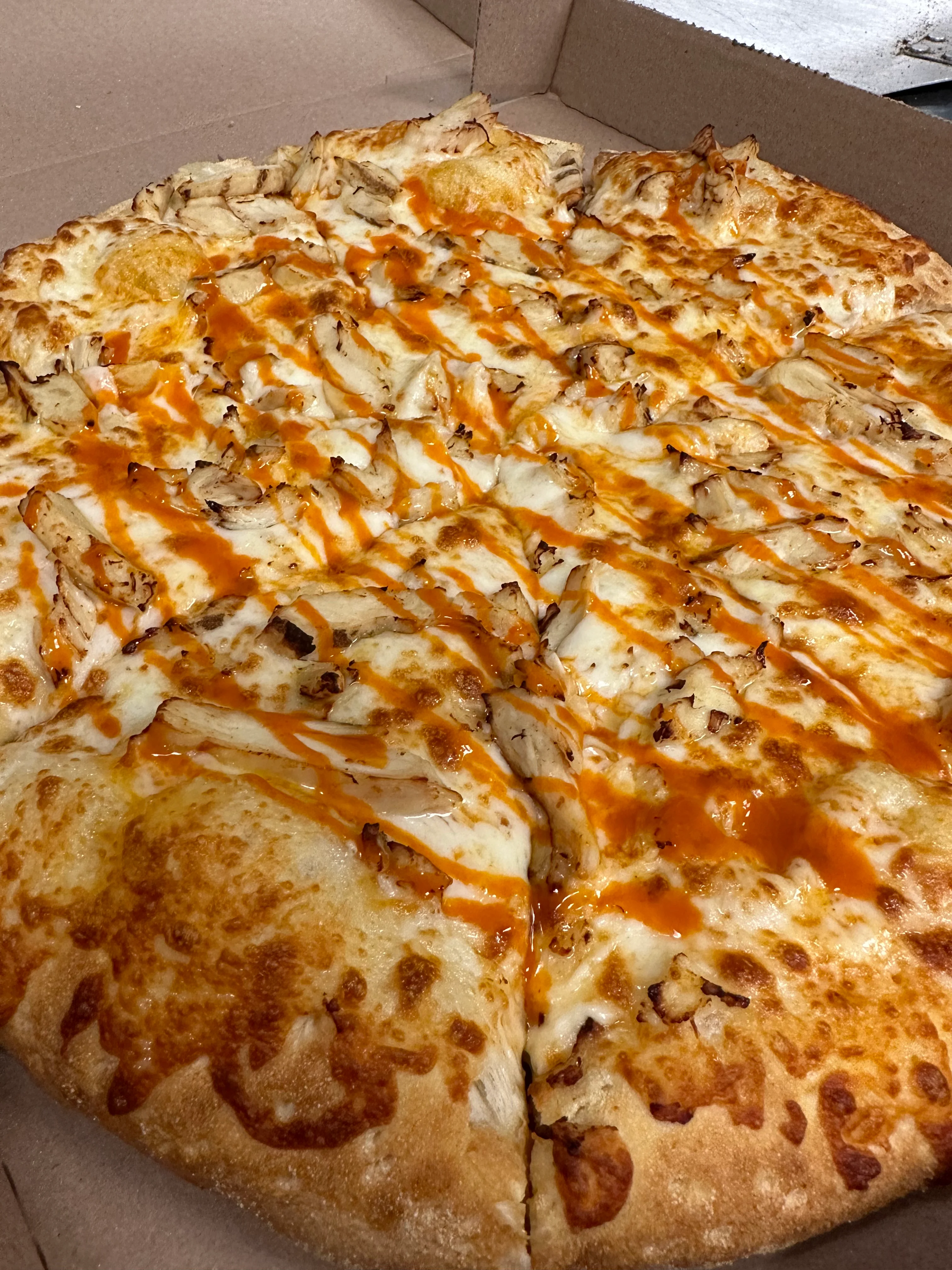 Buffalo chicken pizza with drizzled sauce