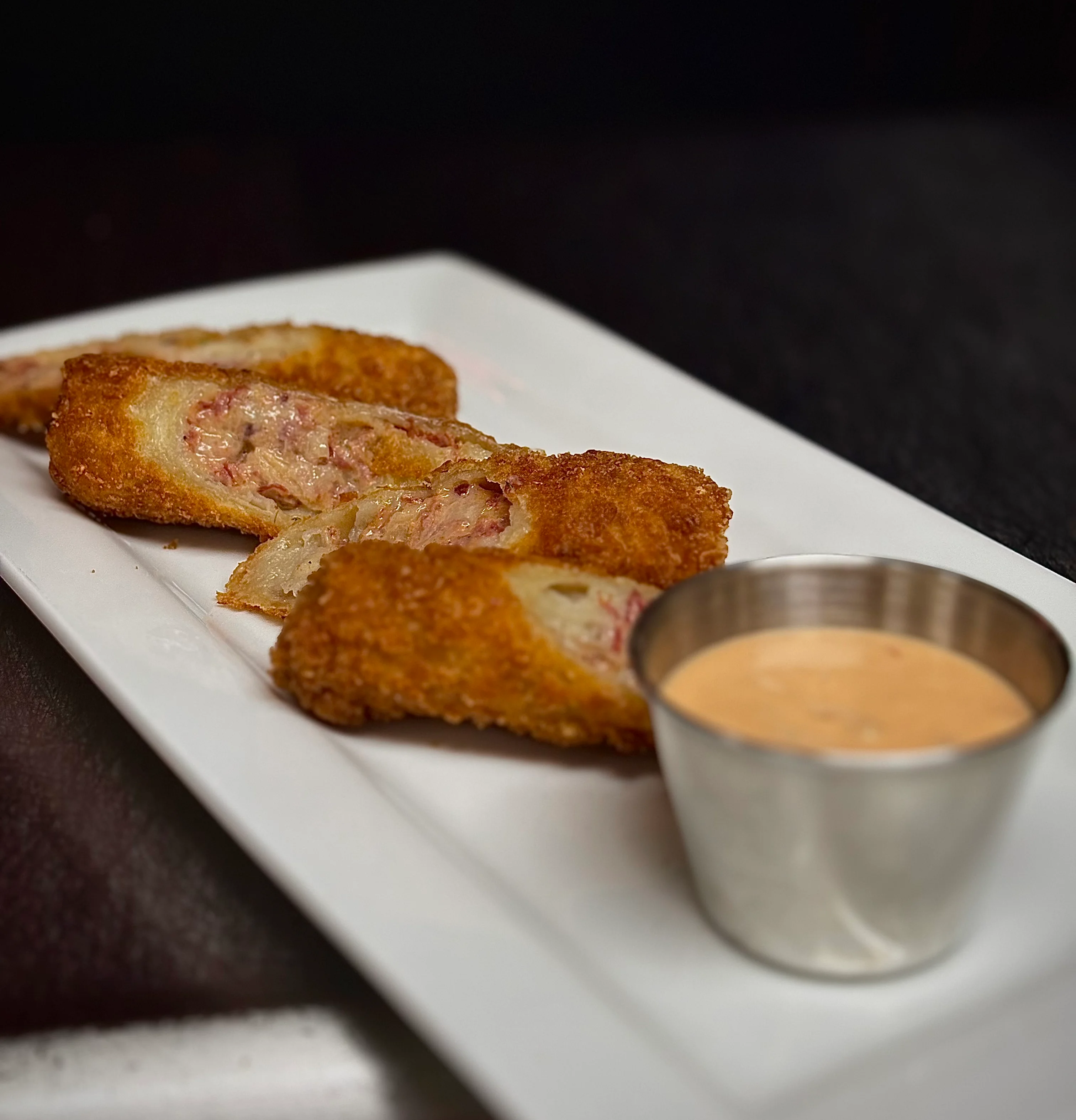 Crispy fried Cuban croquettes with dipping sauce