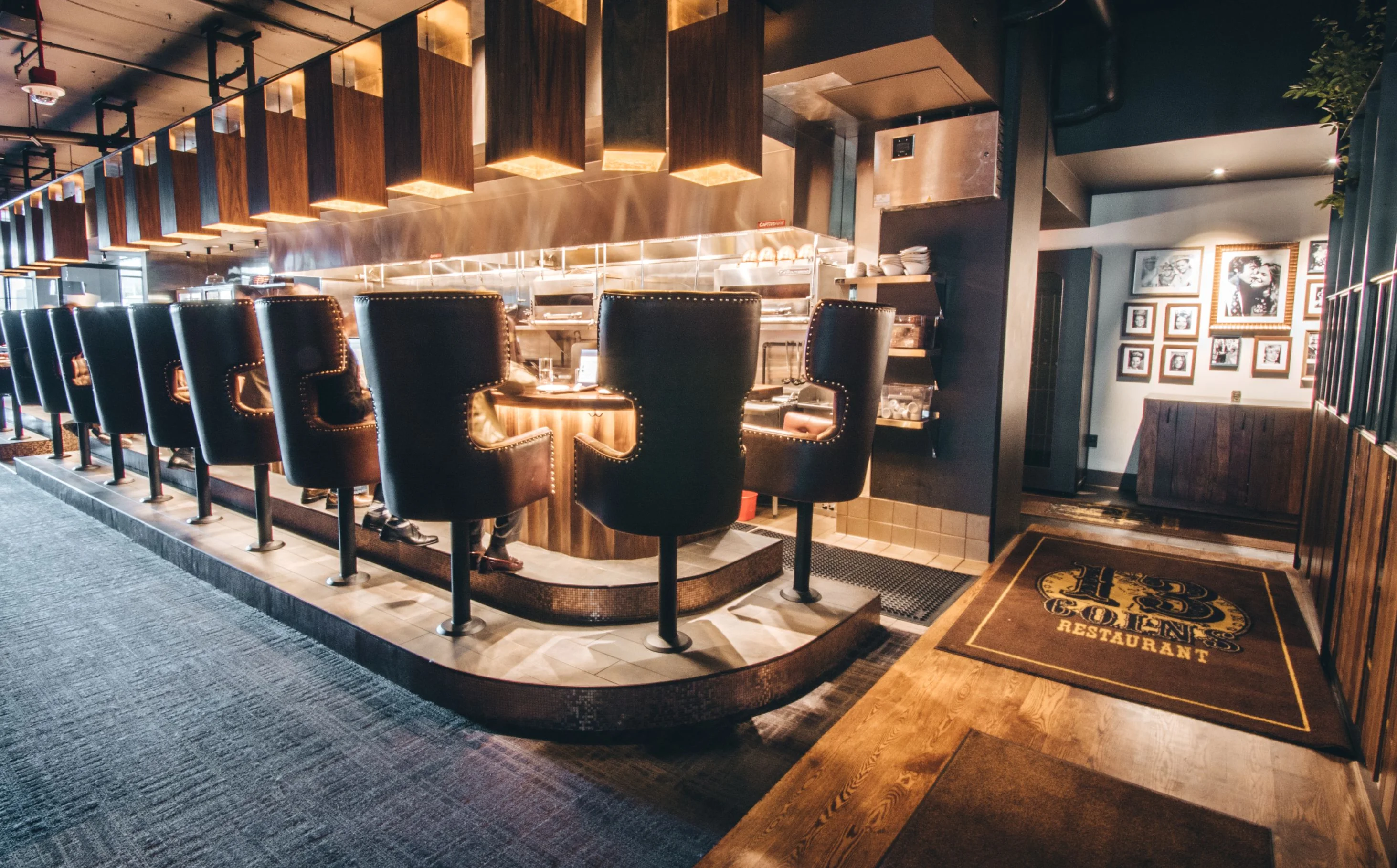 Grilled chicken salad with drinks on a table in a restaurant setting.