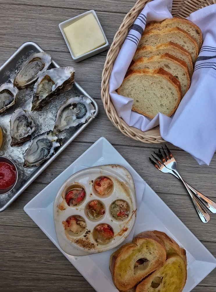 Fresh oysters and escargot in a coastal restaurant setting