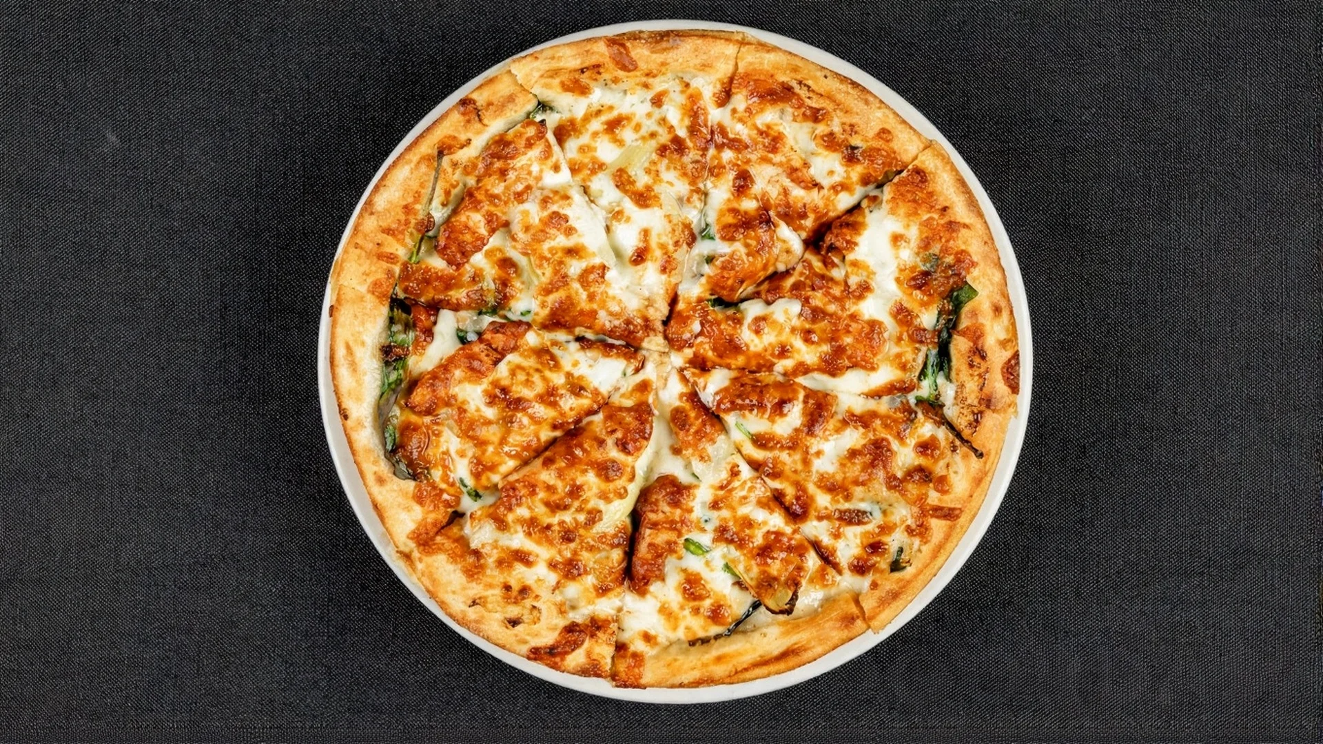 Delicious pizza with various toppings on a wooden table