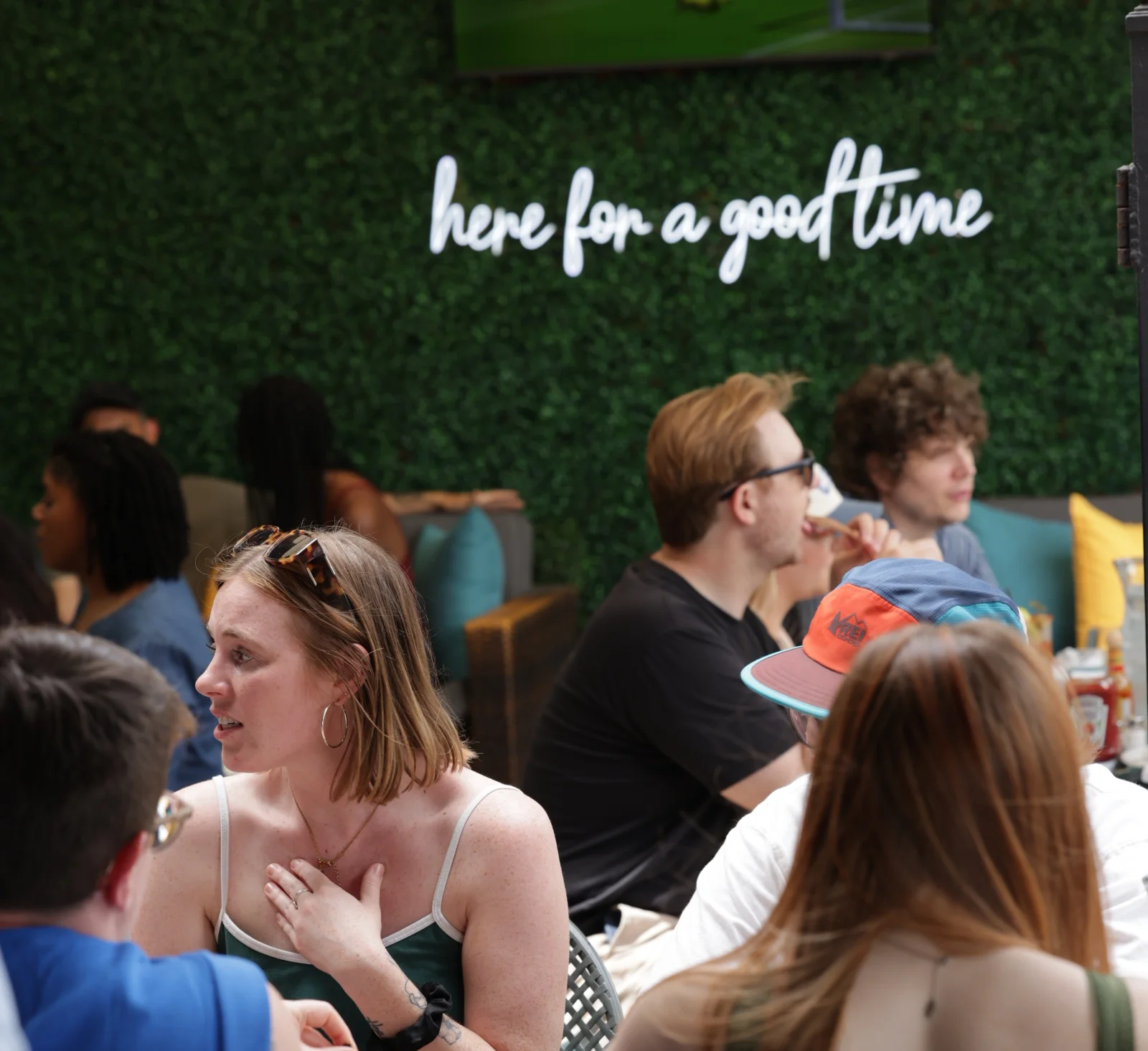 Lively restaurant scene with diners enjoying food and drinks