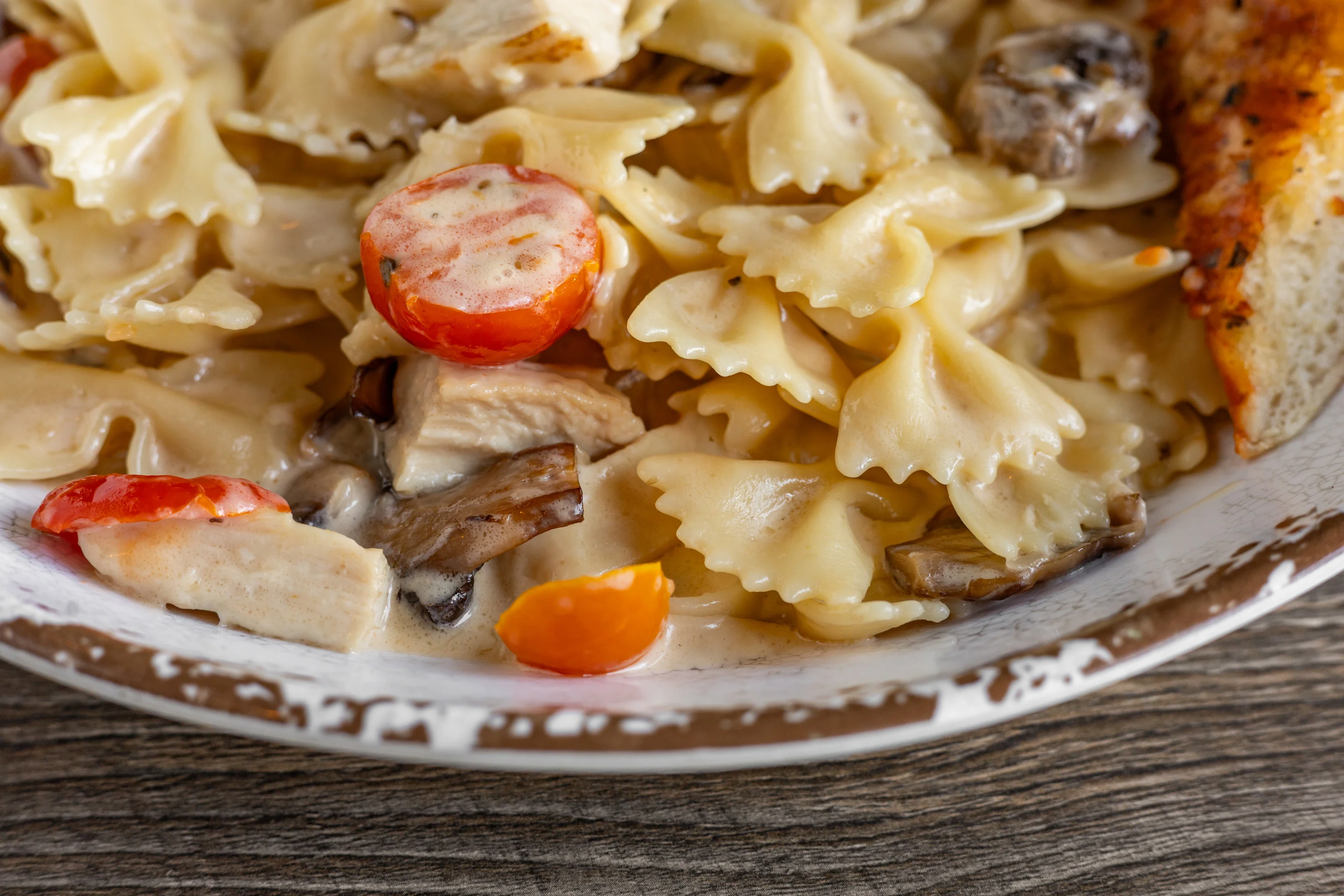 Delicious Chicken Bowtie Pasta served in a bowl with fresh ingredients.