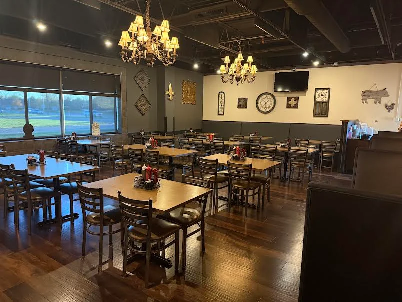 Cozy restaurant interior with elegant chandeliers and wooden tables