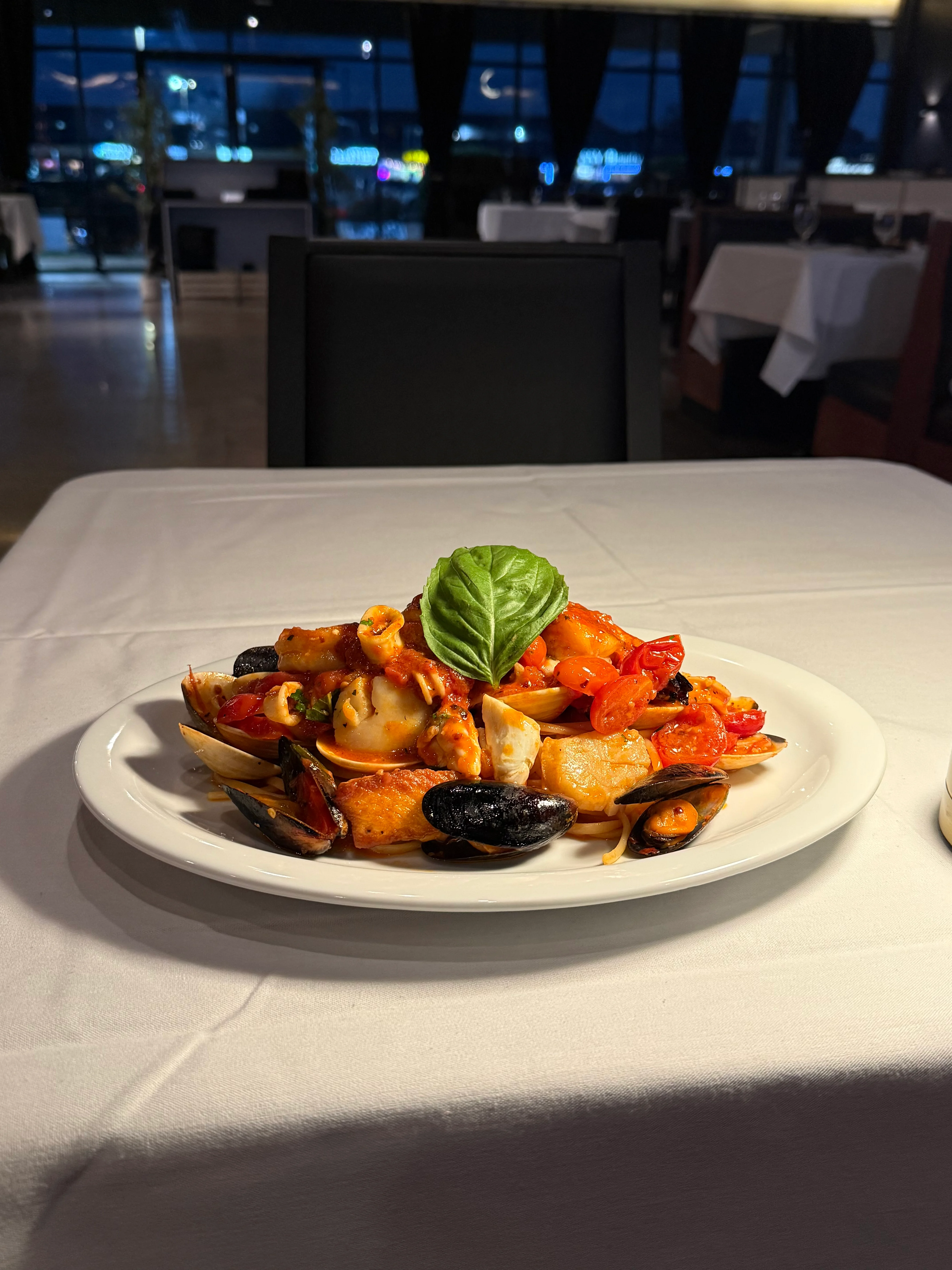 Italian seafood pasta dish with fresh herbs