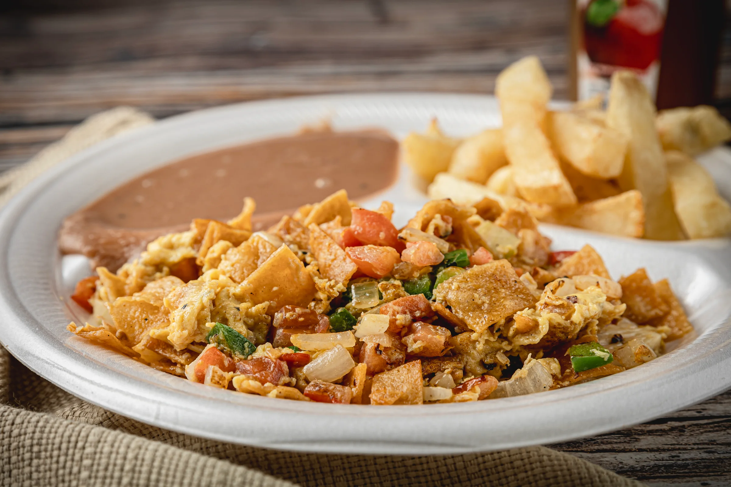 A breakfast scramble with beans and fries