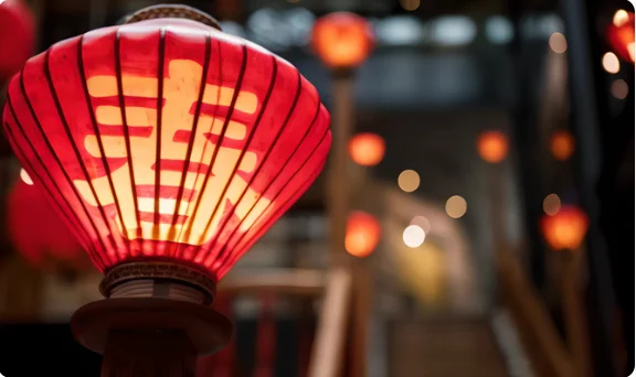 Traditional Japanese lantern illuminating a cozy restaurant atmosphere