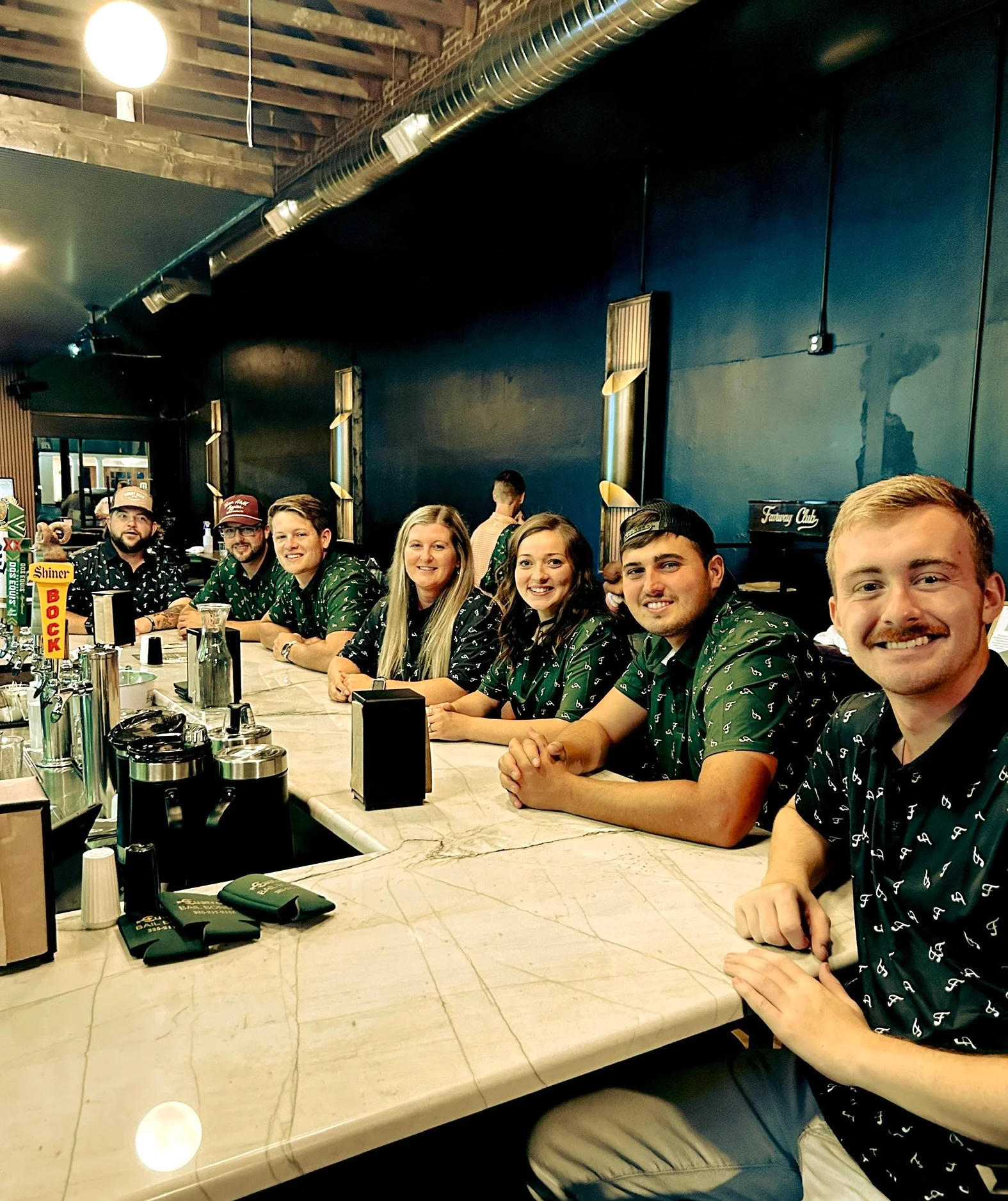 Group of six people in a construction site for a restaurant renovation.