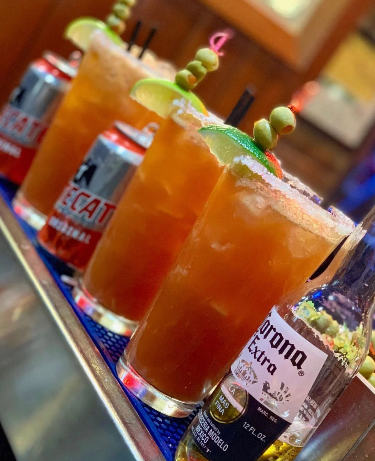 Refreshing cocktails with lime and olives at a vibrant bar
