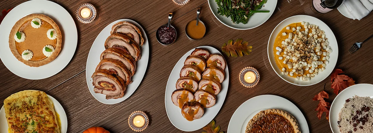 Thanksgiving feast with turkey, pumpkin pie, and seasonal sides