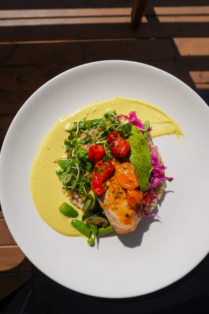 Grilled salmon grain bowl with vibrant toppings