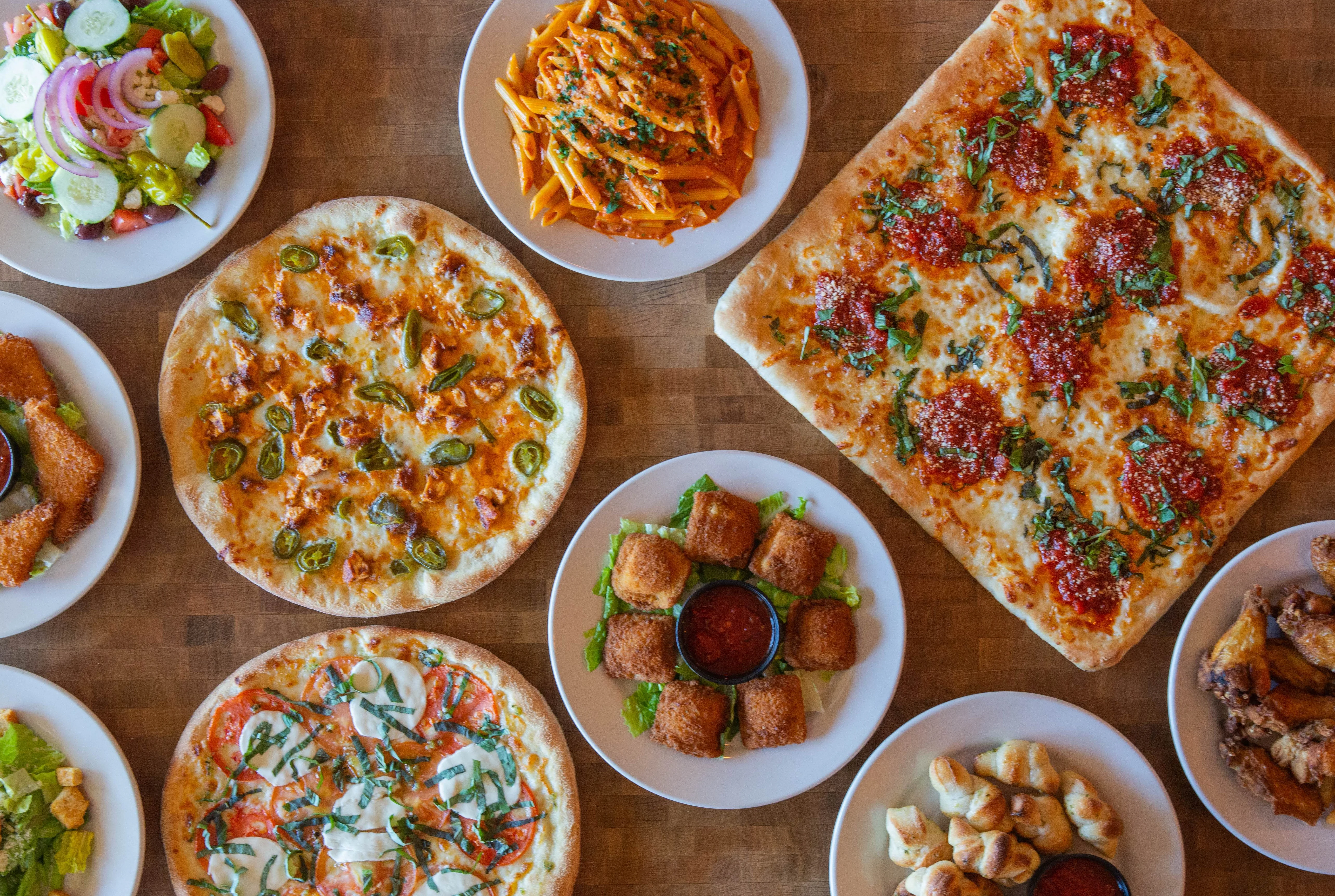 Assorted Italian dishes including pizzas and pasta