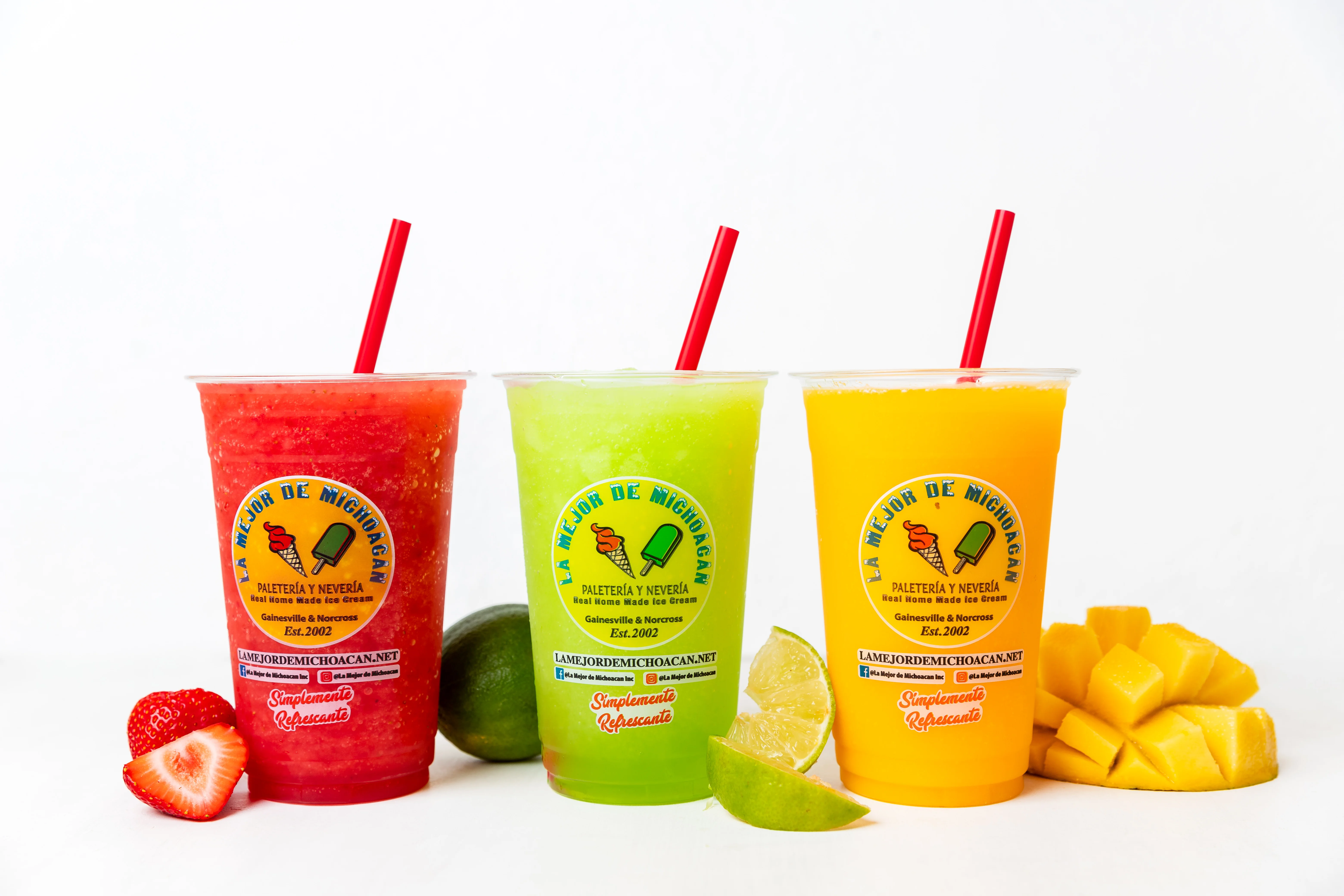Colorful Mexican aguas frescas in clear cups