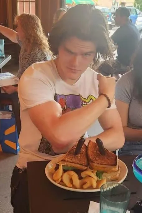 Grilled cheese sandwich with fries in a casual restaurant setting