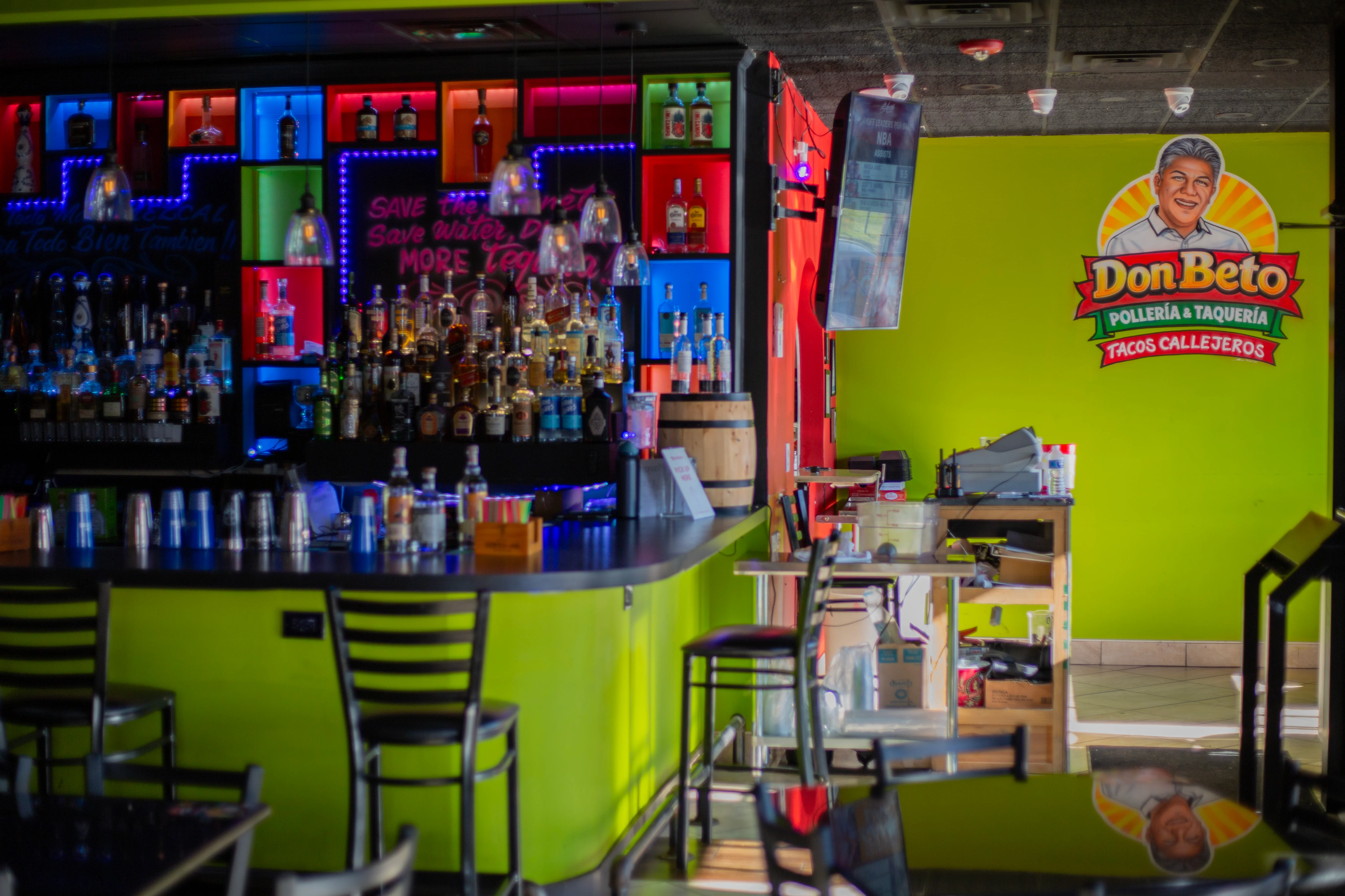 Vibrant bar area in a Mexican taquería with colorful decor