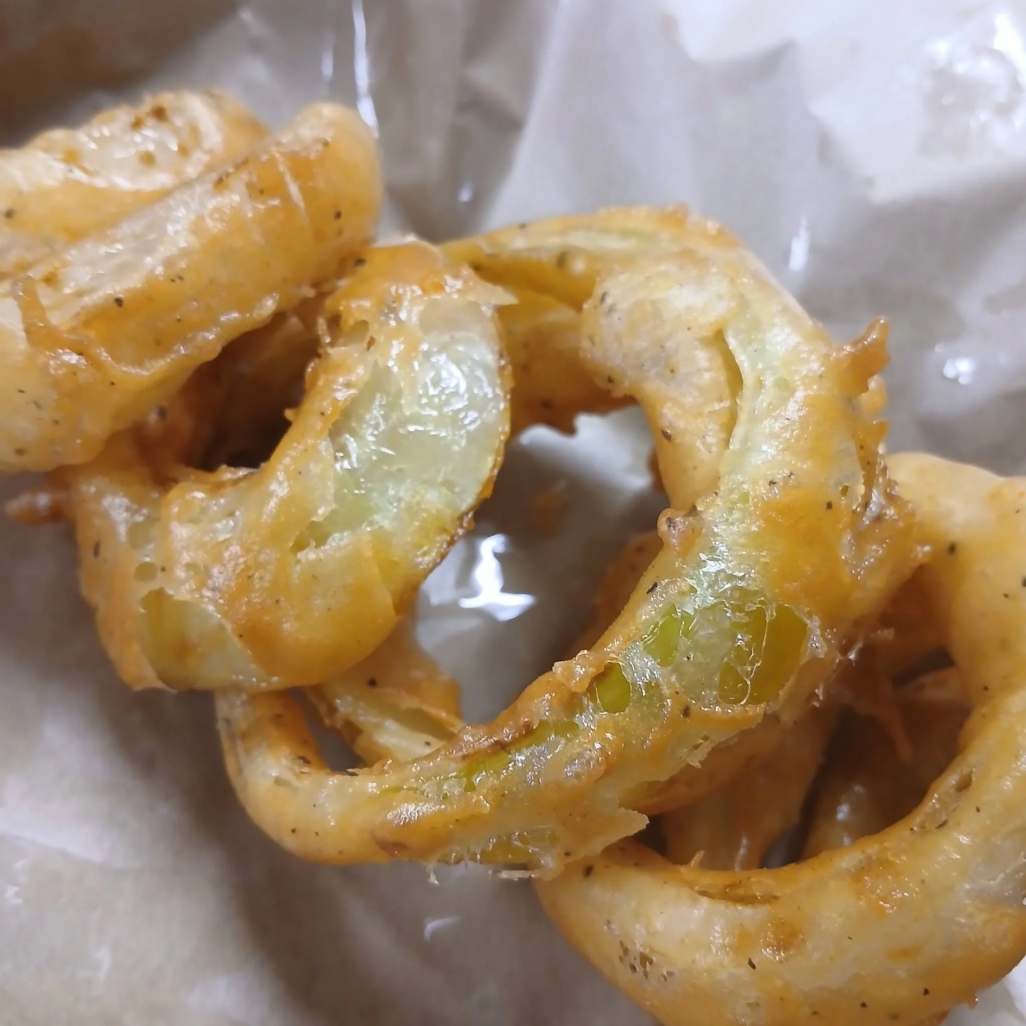 Crispy onion rings served in a casual dining setting