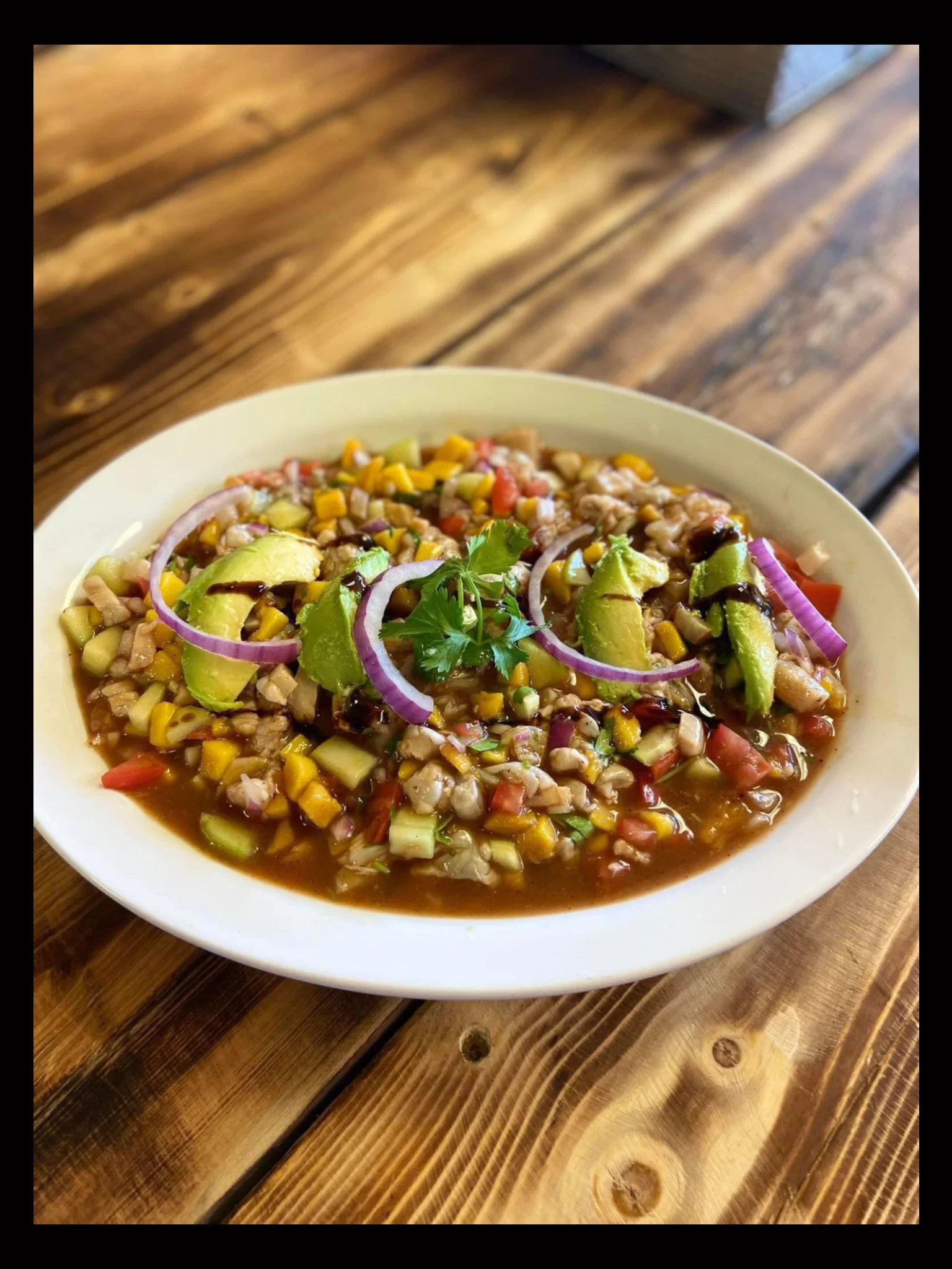 Colorful Mexican ceviche with fresh vegetables