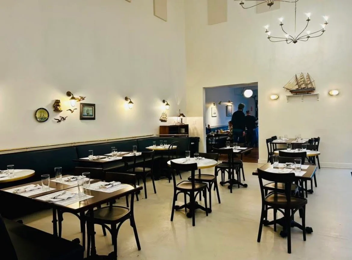 Cozy restaurant interior with nautical decor and warm lighting