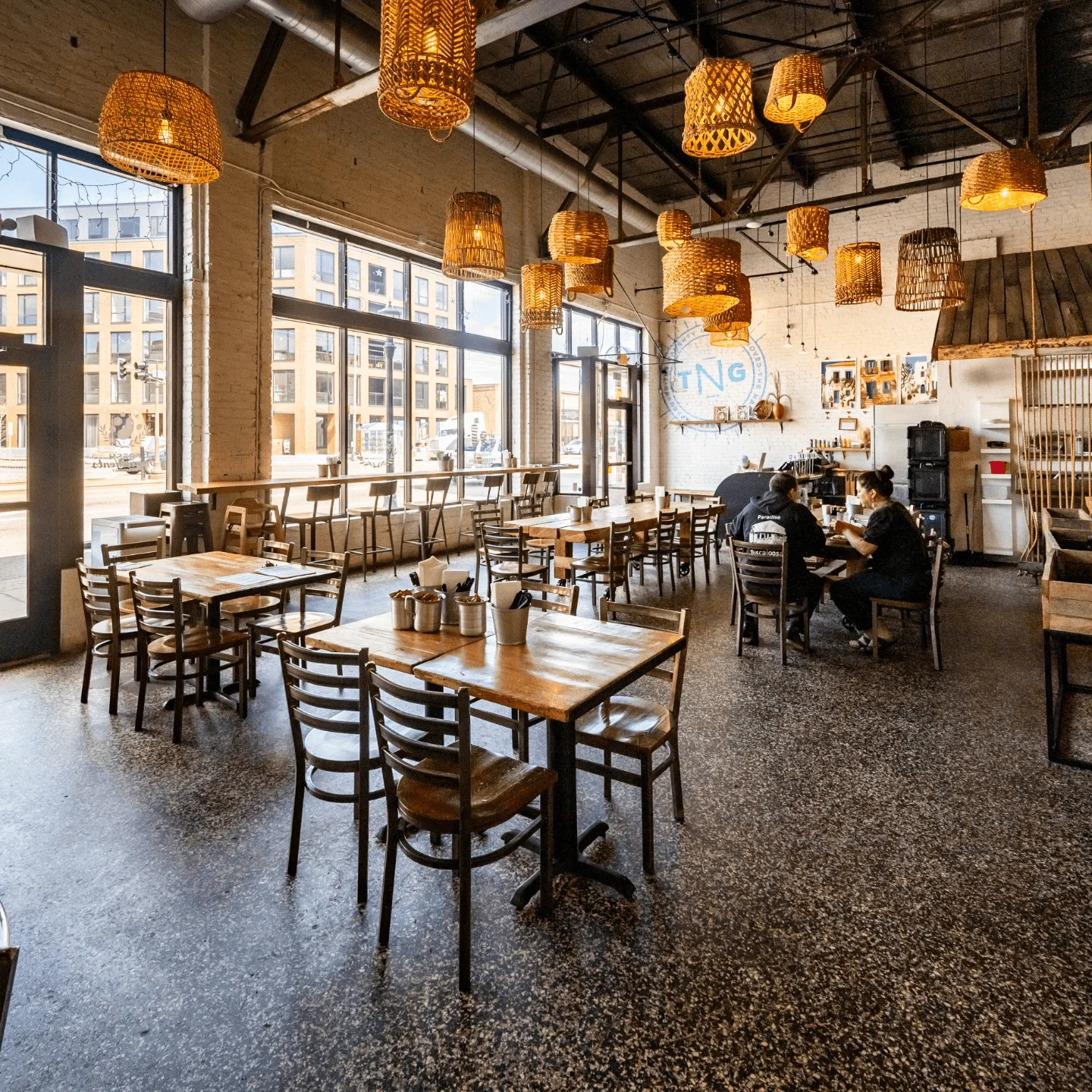 Cozy restaurant interior with warm lighting and wooden tables
