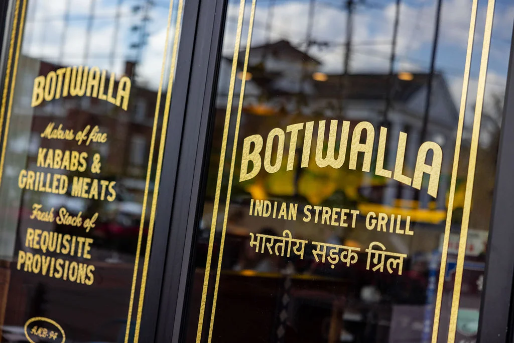 Restaurant window of Botiwalla, Indian street grill specializing in kababs