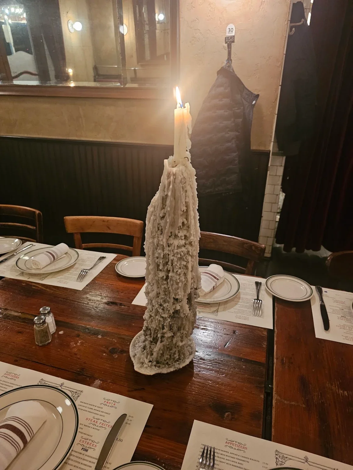 Unique candle centerpiece in a rustic restaurant setting