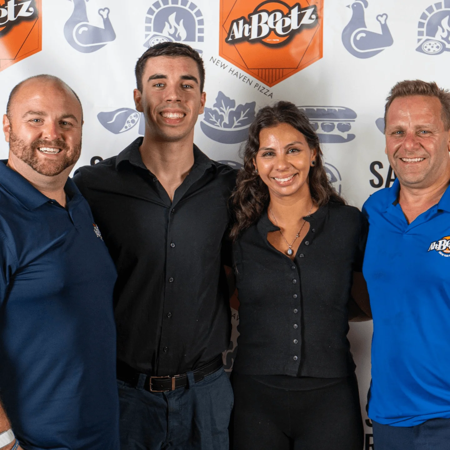 Group of restaurant staff celebrating at Ah Beetz pizzeria event