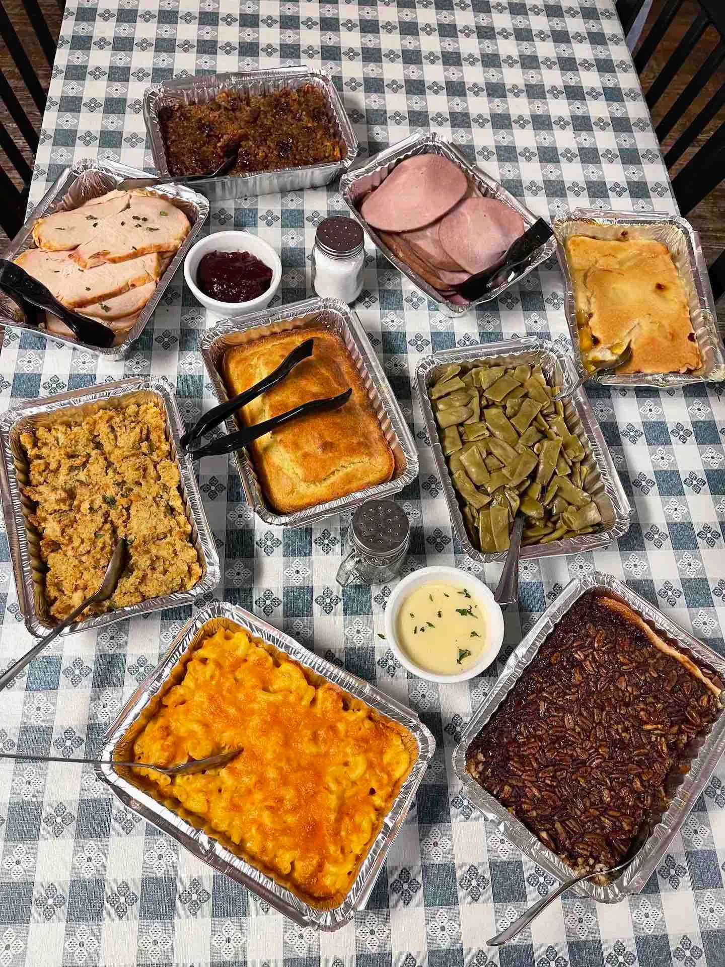 Southern comfort food spread with turkey, ham, and sides