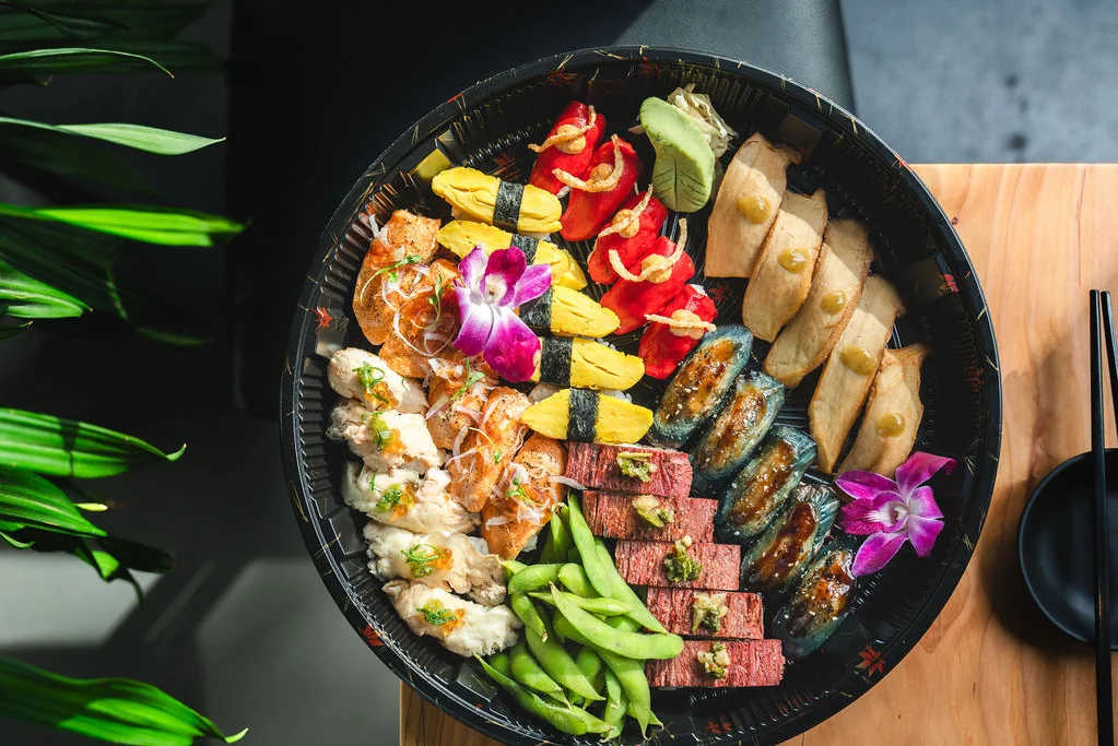 Assorted Japanese sushi platter with colorful rolls and garnishes