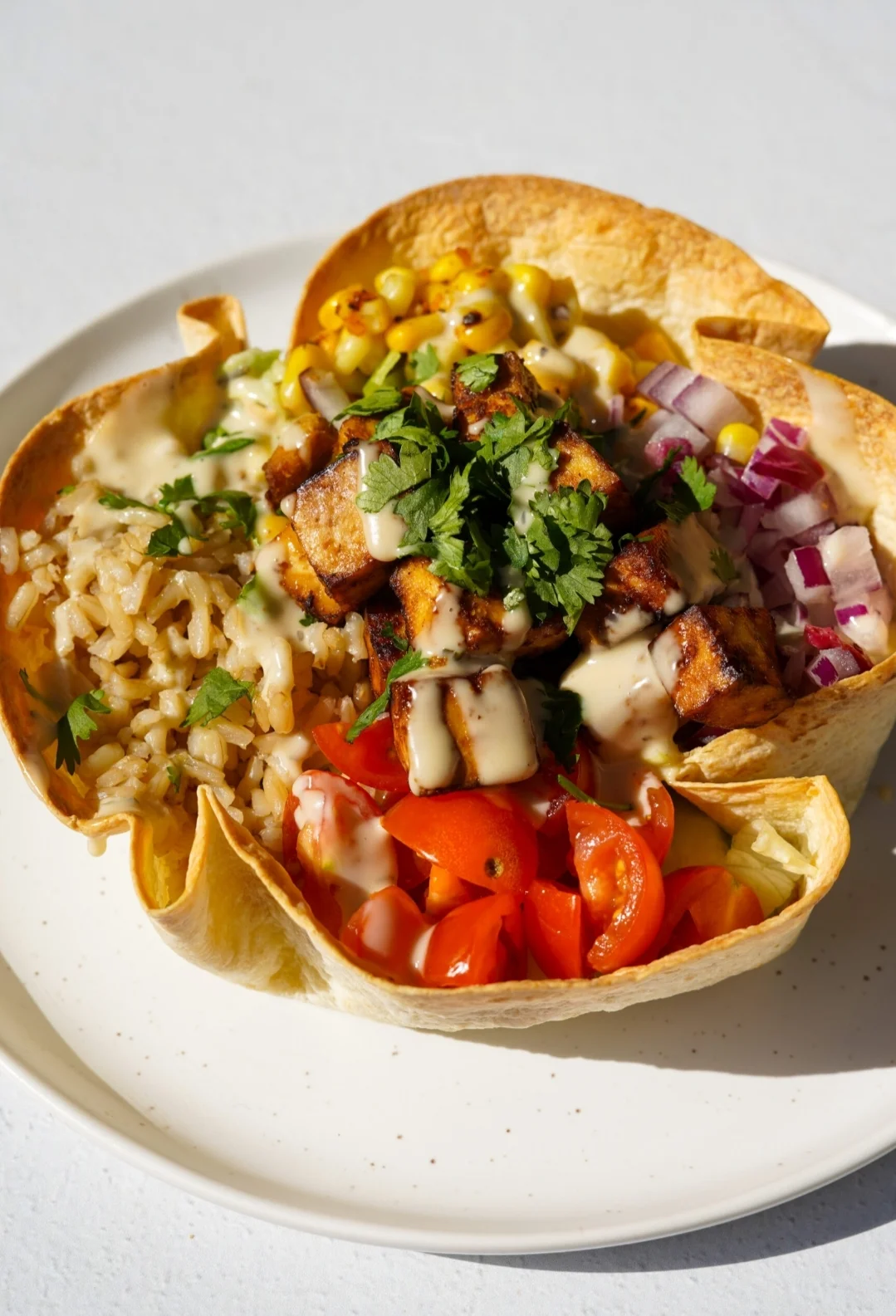 Colorful Mexican burrito bowl with grilled chicken and fresh toppings