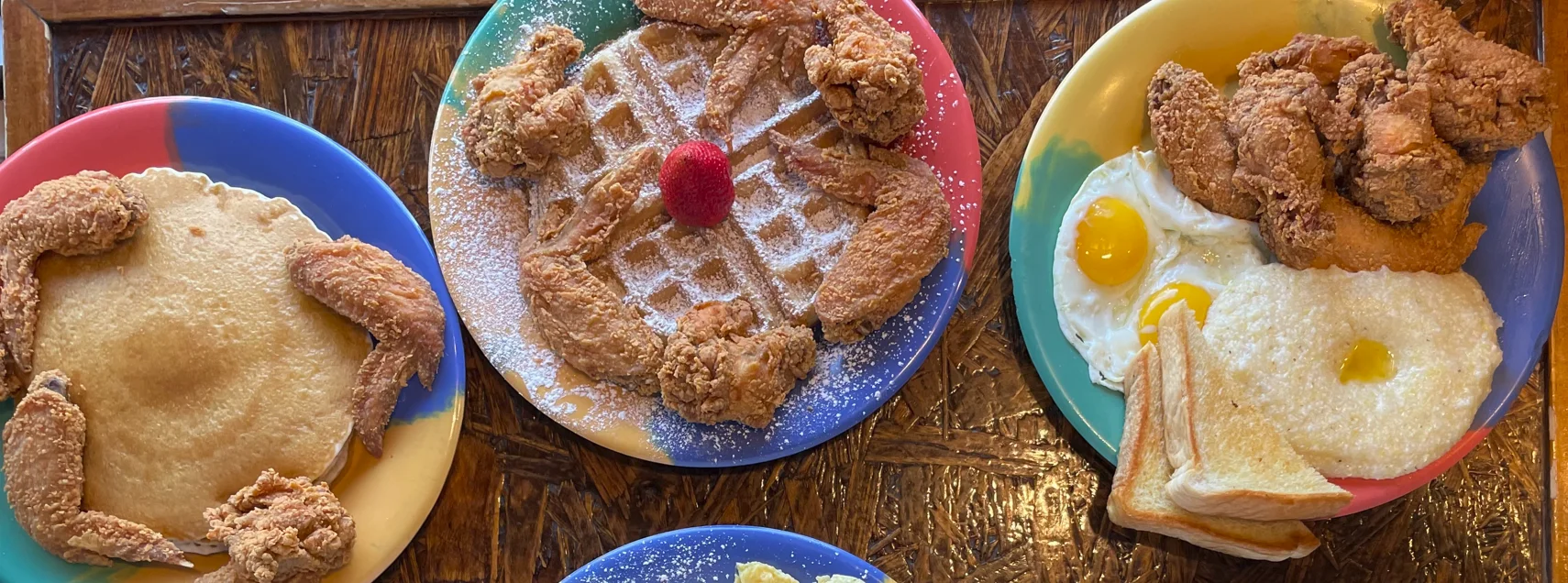 Southern-style chicken and waffles with pancakes and eggs