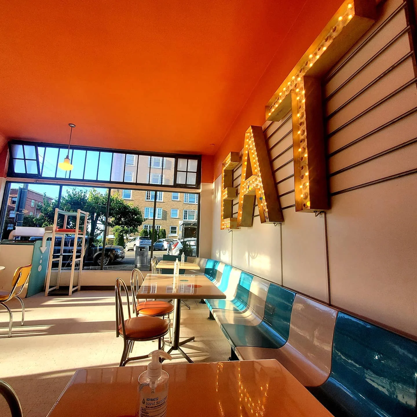 Delicious gourmet burger with fresh toppings on a wooden table