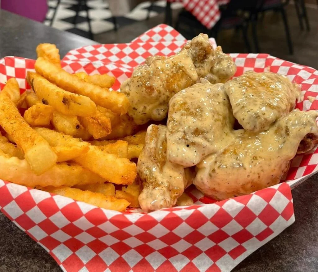 Southern-style chicken wings with gravy and fries
