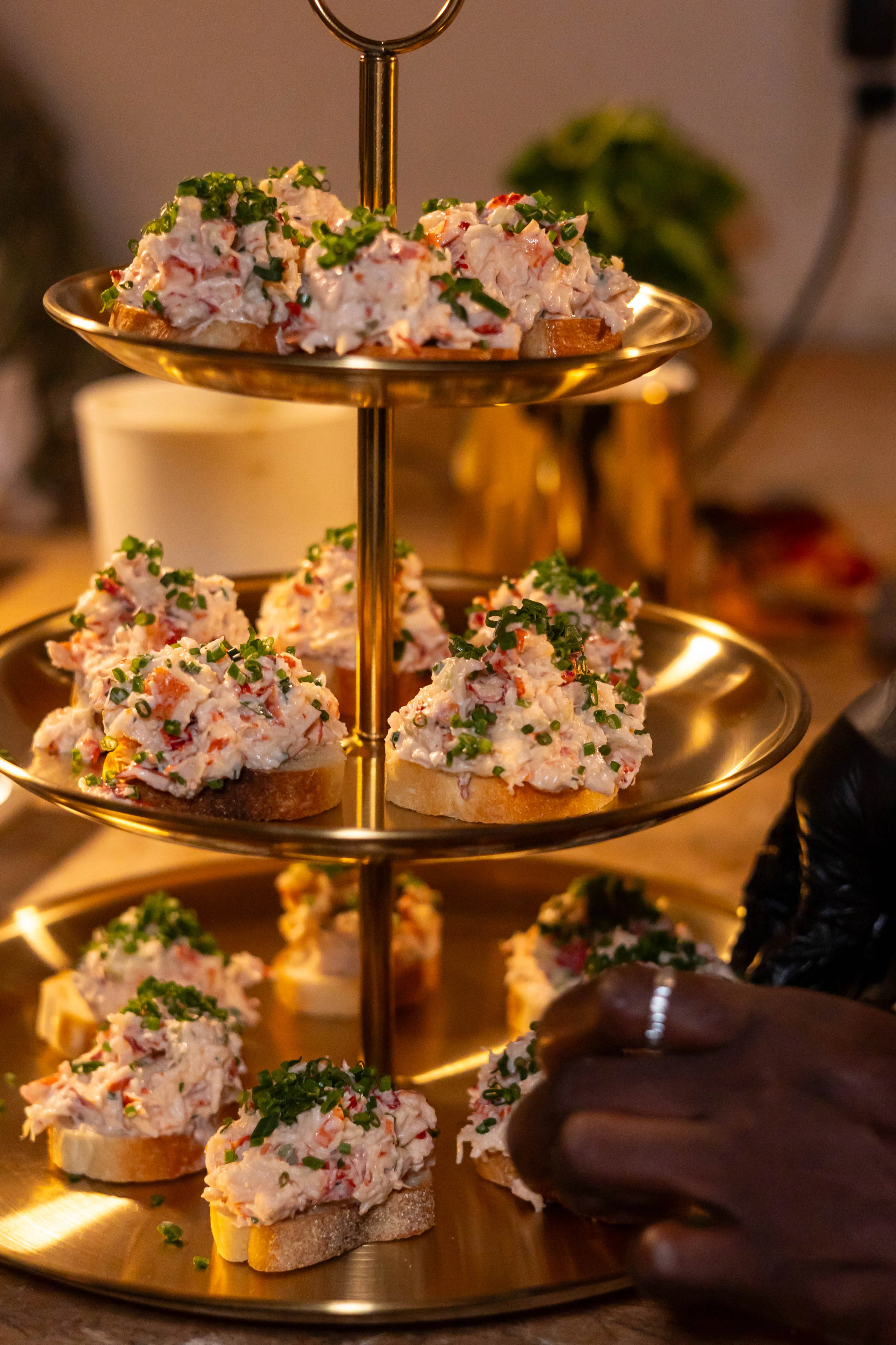 Elegant seafood canapés on a tiered serving stand