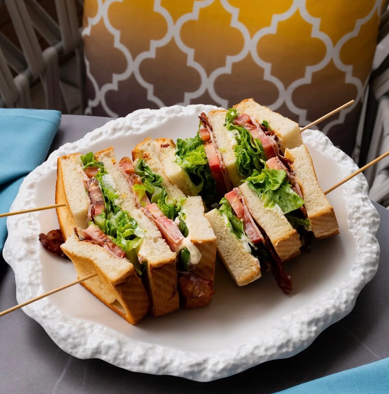 Classic club sandwich with layers of lettuce and bacon