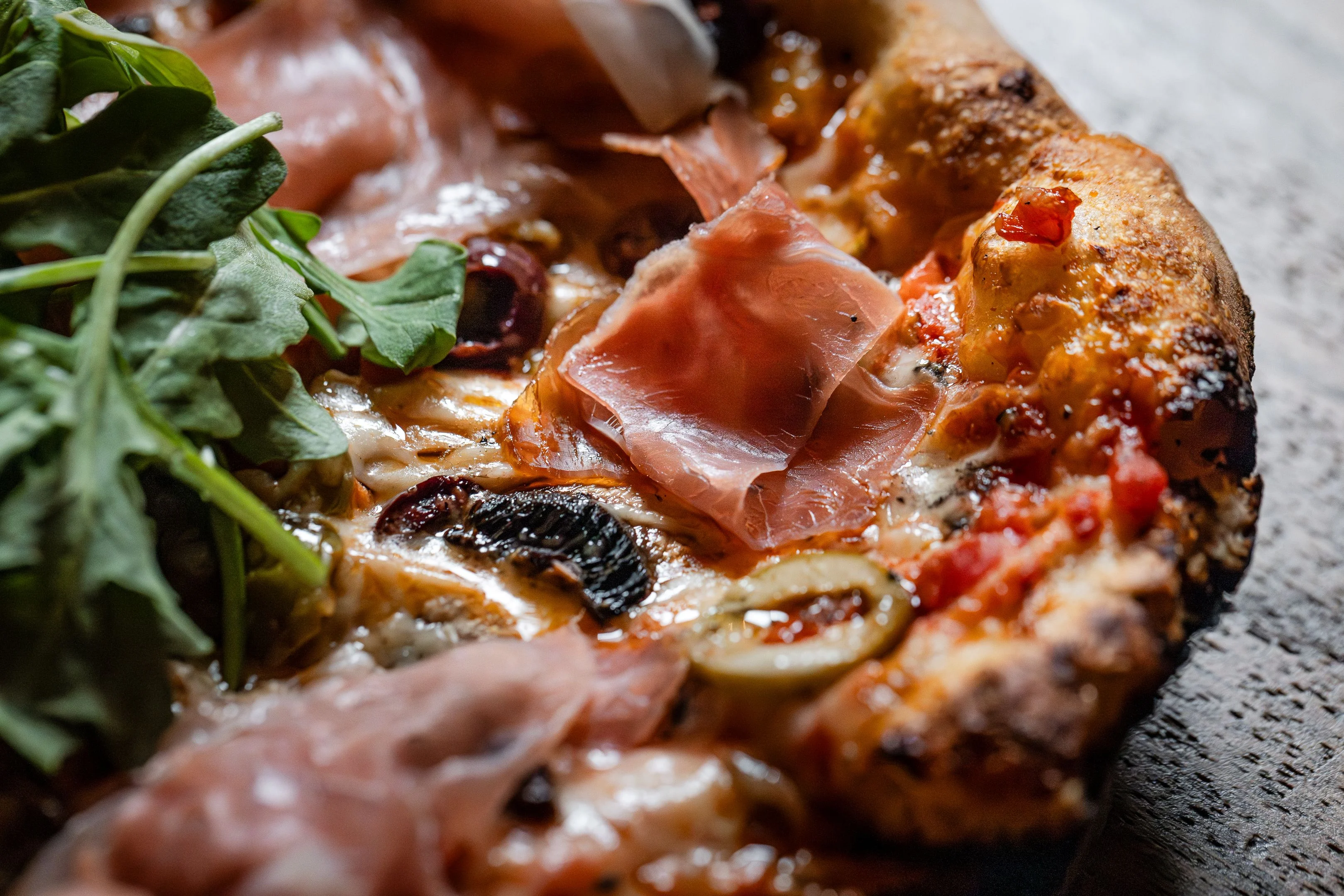 Italian prosciutto pizza with arugula