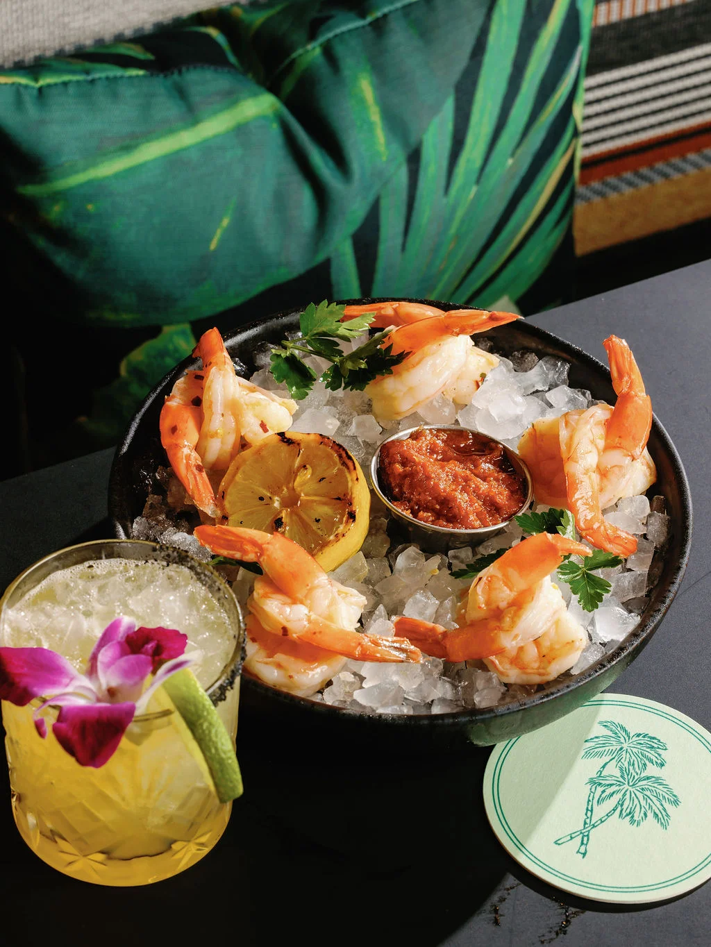 Vibrant nachos topped with fresh ingredients and sliders at a lively restaurant