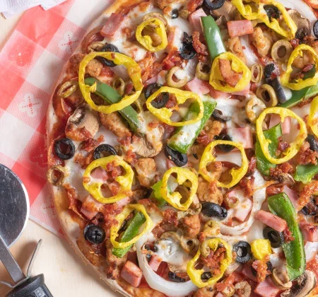Loaded supreme pizza with colorful toppings