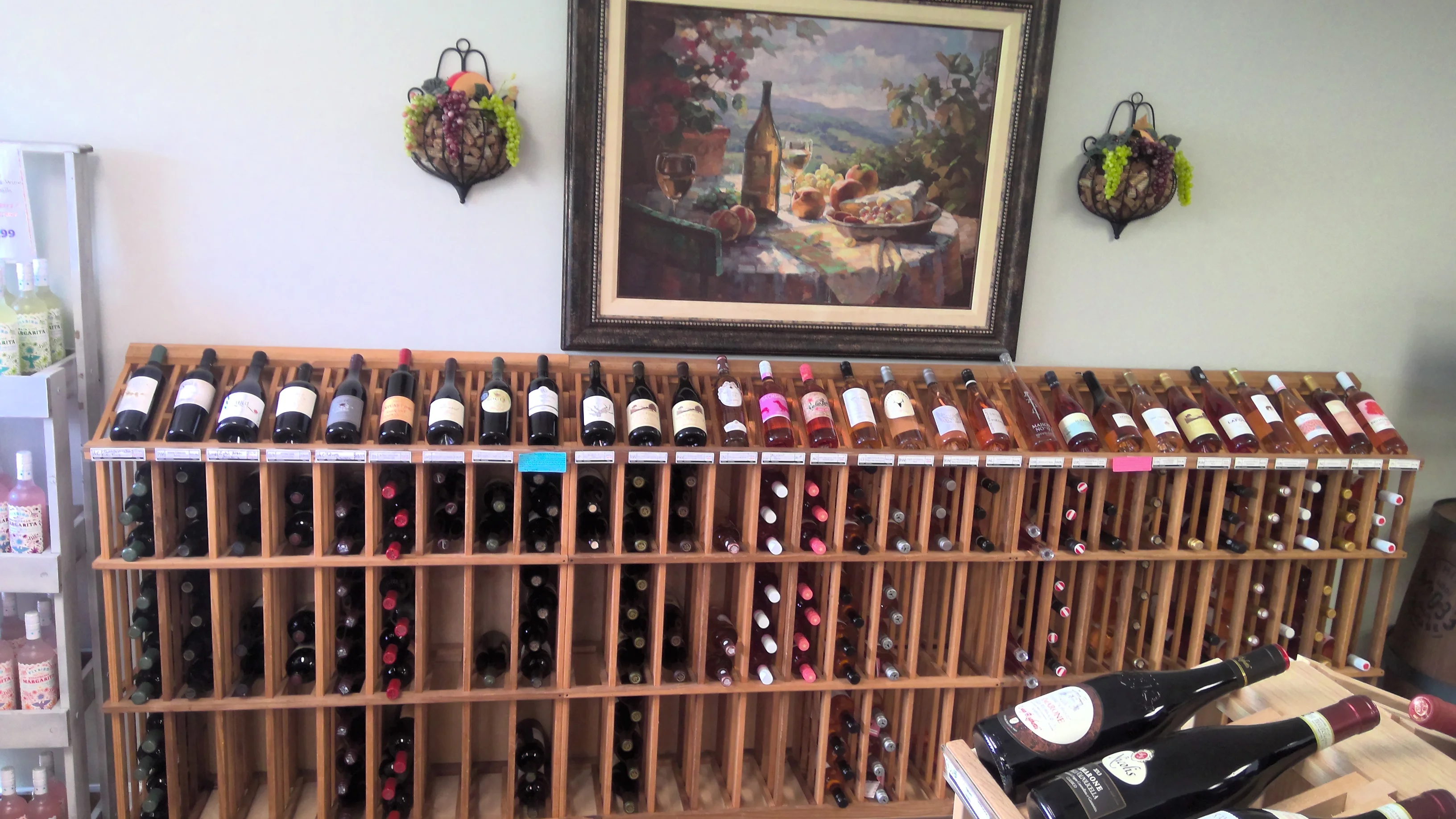 Wine display with various bottles in a cozy setting